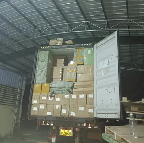 Warehouse team loading a 40ft container for international shipping